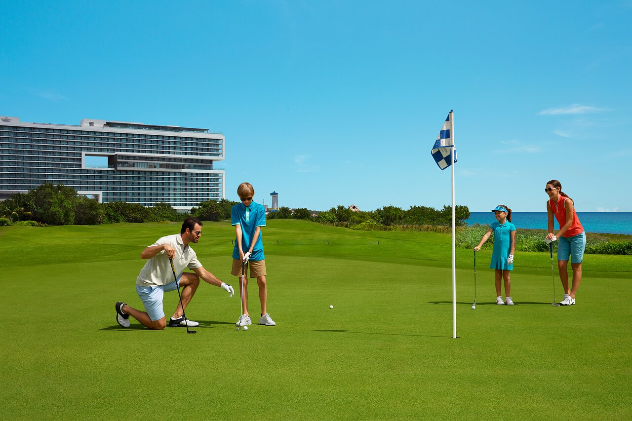 Family playing at Puerto Cancun Golf Club