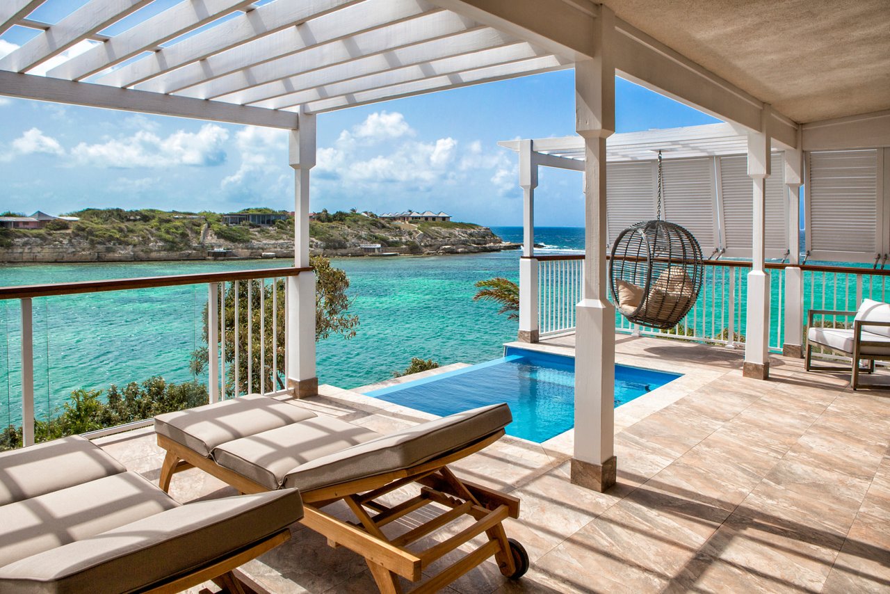 Spacious outdoor living area in a luxury Waterfront Villa at Hammock Cove Resort & Spa, Antigua. A 5-Star, all-inclusive, adults only resort.